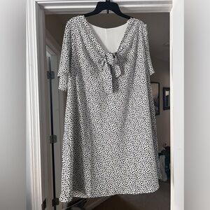 White dress with leopard print and front tie detail